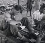 Edmund Hillary reads his mail after coming back down from the summit of Everest